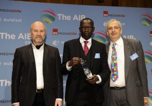 Abdul Rahman Ramadhan (centre) receives the AIB Founders Award from Alexey Nikolov, Chairman of the AIB Executive Committee and Managing Director, RT (left) and Simon Spanswick, Chief Executive, AIB (right) 